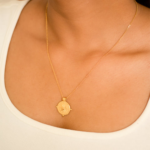 Shine bright like the sun with our Sun Chakra Necklace! This unique necklace features a radiant sun charm representing vitality and energy. Keep your chakras balanced and embrace your inner light with this playful accessory.  Material: Stainless Steel Plating: 18K Gold-Plated Waterproof Hypoallergenic Anti-tarnish