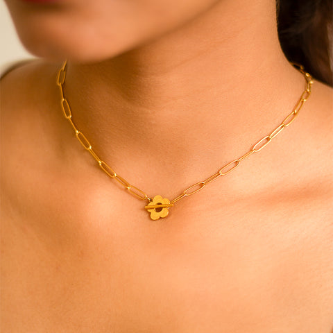 Get ready to blossom with our Blossom Choker! This unique choker features delicate blossoms that add a touch of whimsy to any outfit. Stand out from the crowd and embrace your playful side with this must-have accessory.&nbsp;  Material: Stainless Steel Plating: 18K Gold-Plated Waterproof Hypoallergenic Anti-tarnish